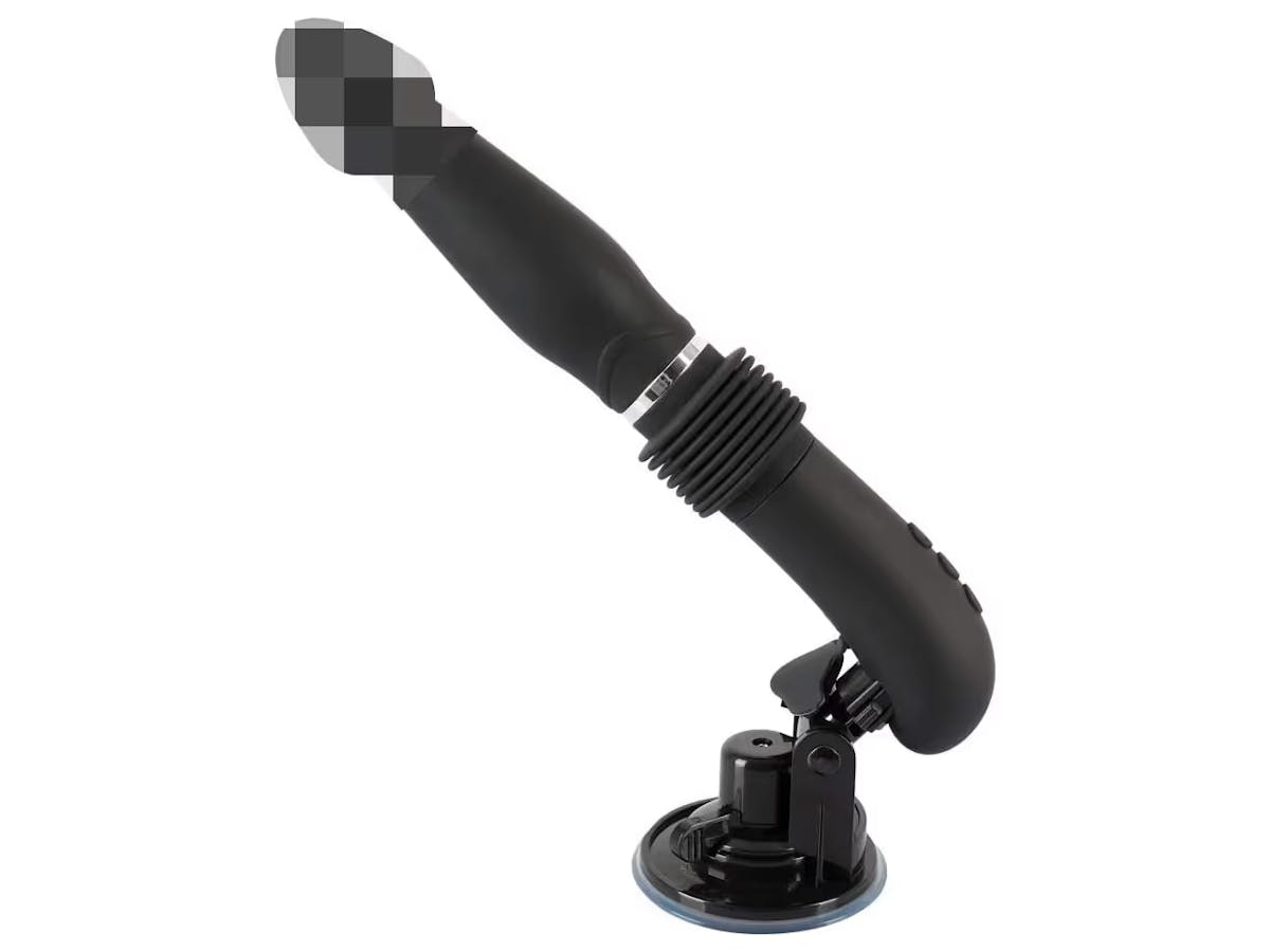 The sex machine is a special form of vibrator that can be attached to straight surfaces using a suction cup.  According to the description, it can be operated without hands thanks to a remote control.  What you then press the remote control with is up to your imagination.