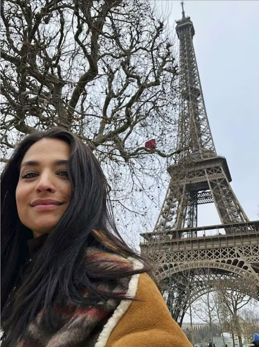Amira Pocher in front of the Eiffel Tower in Paris.